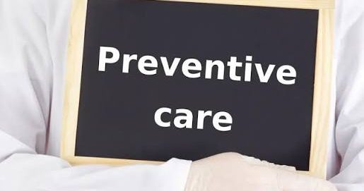 Advanced Health Solutions: gloved clinician in a white coat holding a chalkboard sign that reads Preventive care