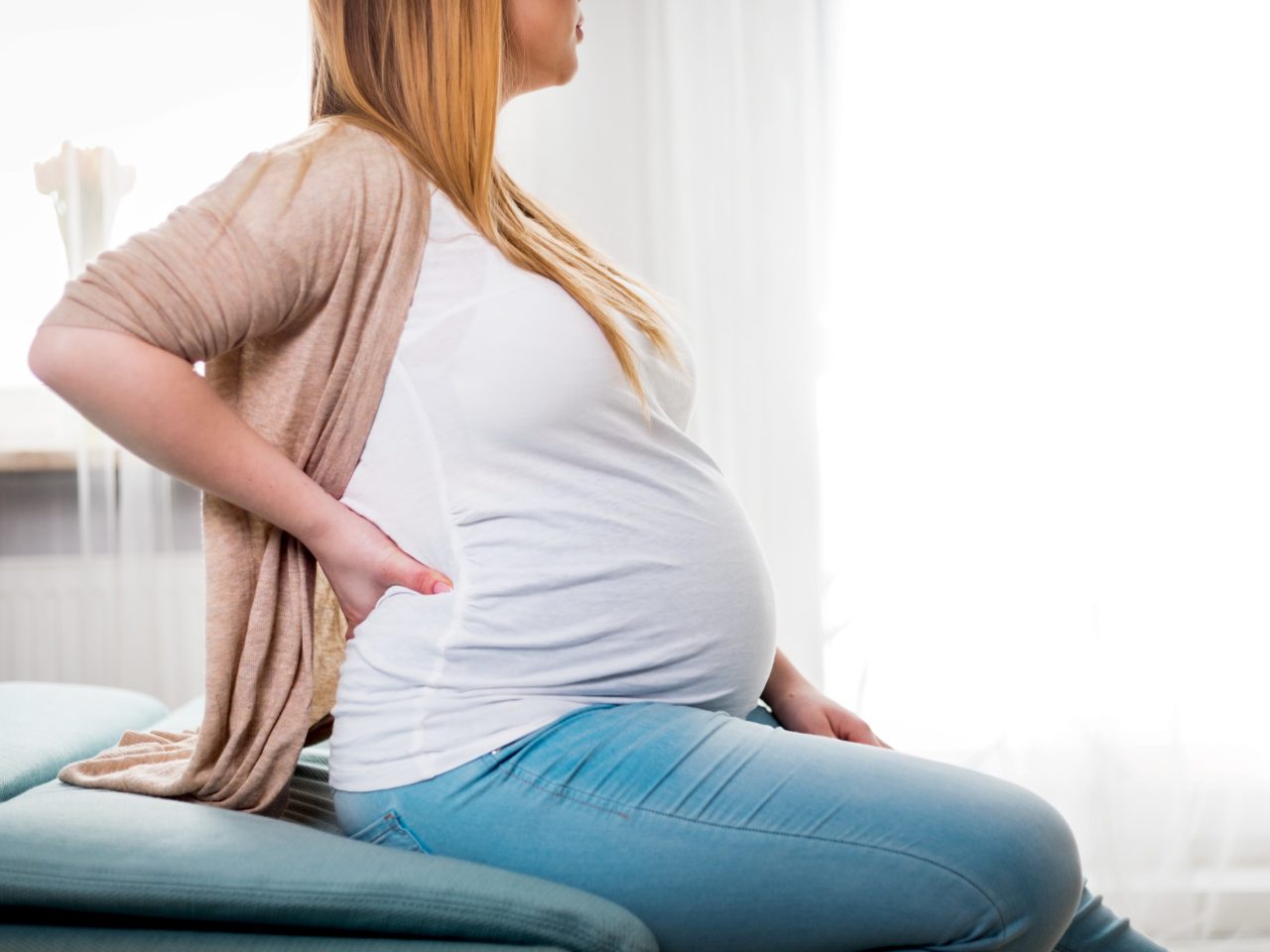 Advanced Health Solutions: pregnant woman with lower back pain